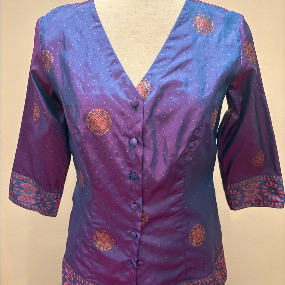 Vibrant Women's Blouse in Purple and Blue with gold dots and bottom border.